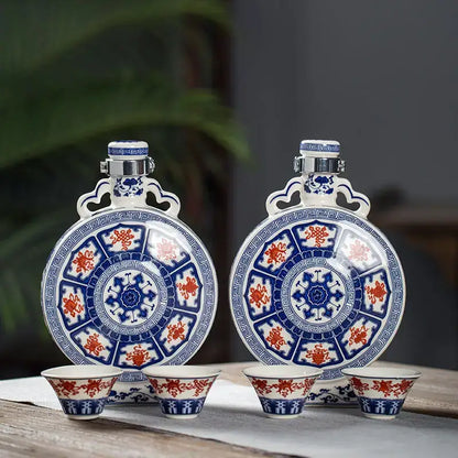 Pair of blue and red porcelain hip flasks with matching cups featuring intricate traditional white eight treasures ceramic patterns