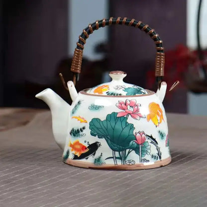 White porcelain teapot with hand-painted goldfish and lotus design and woven bamboo handle by decorbites blue