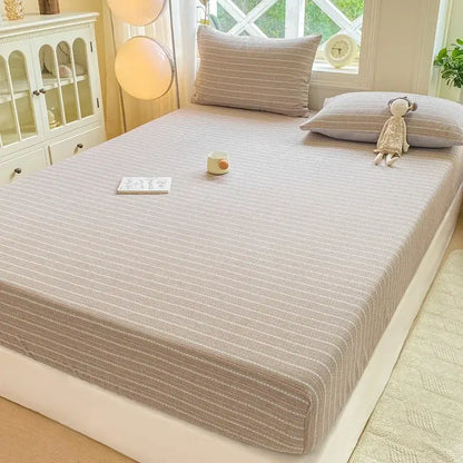 Beige striped fitted sheet set with subtle vertical lines and soft textured fabric for bedroom use