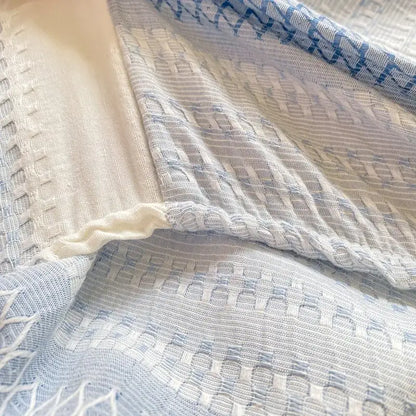Blue and white striped cotton jacquard fitted sheet set with textured basketweave pattern for bedroom use
