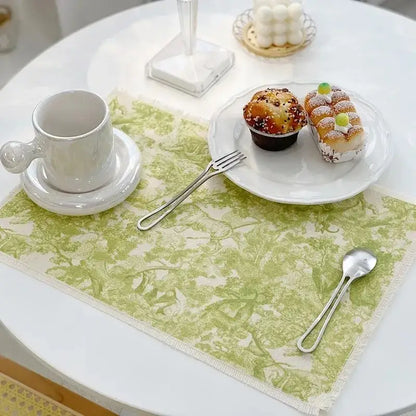 A delicate light green lace cotton linen place mat with subtle tree pattern and frayed edges for decorbites cotton linen decor