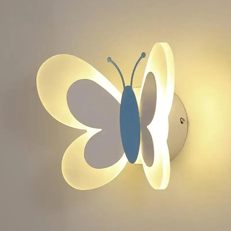 A blue butterfly girl cartoon children room lamp with translucent wings emitting a soft white and blue glow