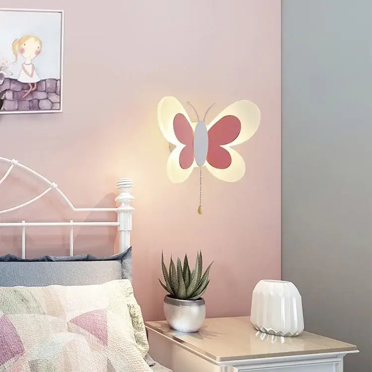 A soft pink and white butterfly girl cartoon wall lamp with hanging pull chain for girl cartoon children room bedroom