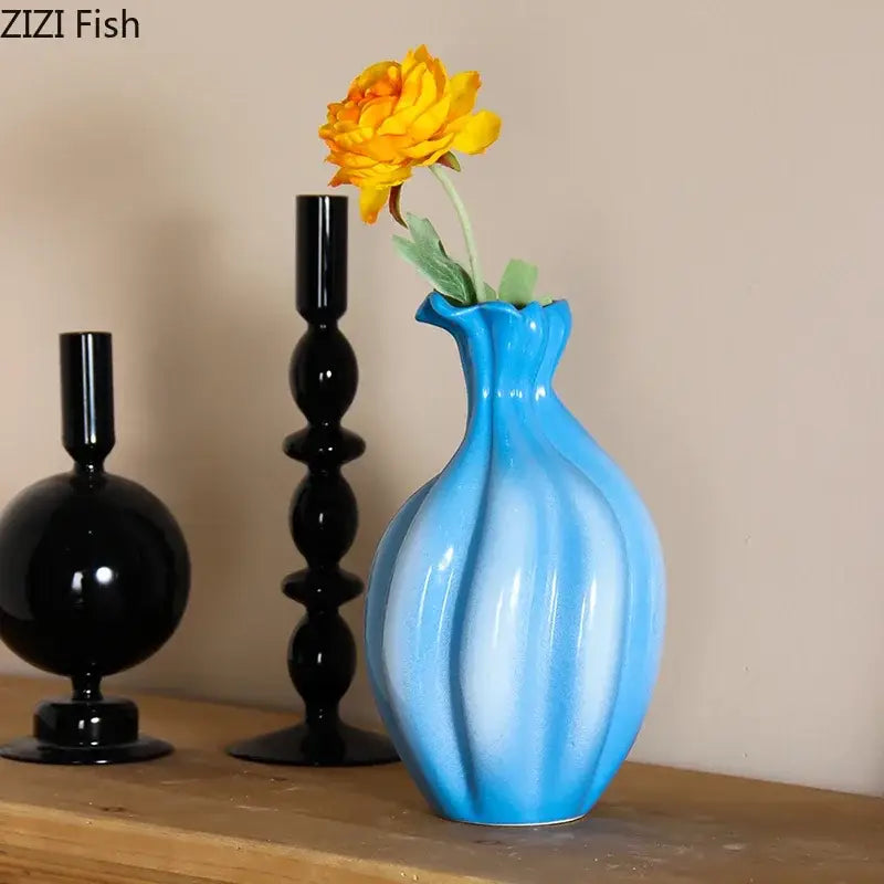 A decorbites blue ceramic flower bud vase with a fluted ribbed design and blue and white gradient for living room decor