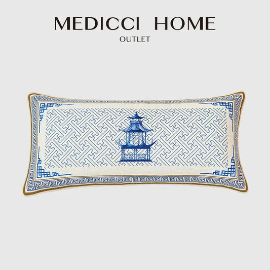 A rectangular blue chinoiserie home pagoda cushion cover with white embroidery and intricate geometric patterns