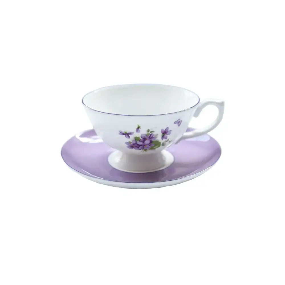 A delicate white porcelain tea set with lavender floral pattern and subtle purple accents from the blue dream tea collection