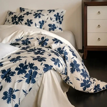 Cream-colored duvet cover with bold navy blue floral pattern in decorbites 100s egyptian cotton bedding set
