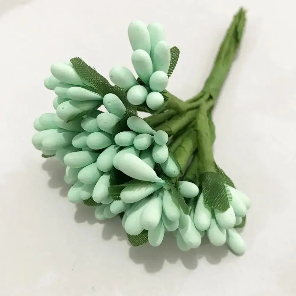 A delicate cluster of mint-green decorbites blue flower cherry artificial flowers with flower cherry stamen wrapped in green mesh