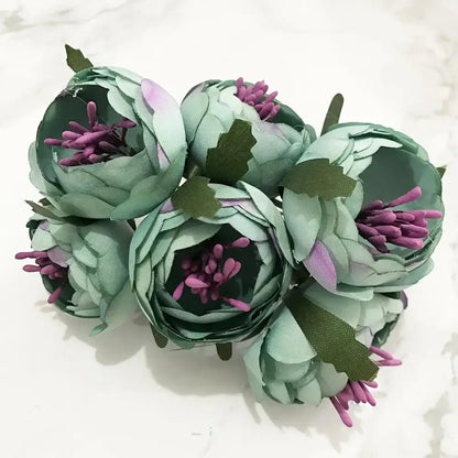 A decorbites blue flower cherry stamen bundle featuring mint-green fabric petals and purple stamens for living room decor