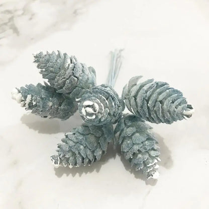 Frosted gray artificial pinecones with white snow-like coating and textured scales in decorbites blue flower cherry stamen berries bundle for living room decor