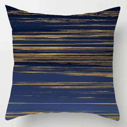 A navy blue geometric marble throw pillow with horizontal gold brushstroke stripes for decorbites blue geometric decor