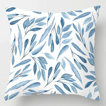 White throw pillow with blue leaves pattern complementing decorbites blue geometric marble living room decor