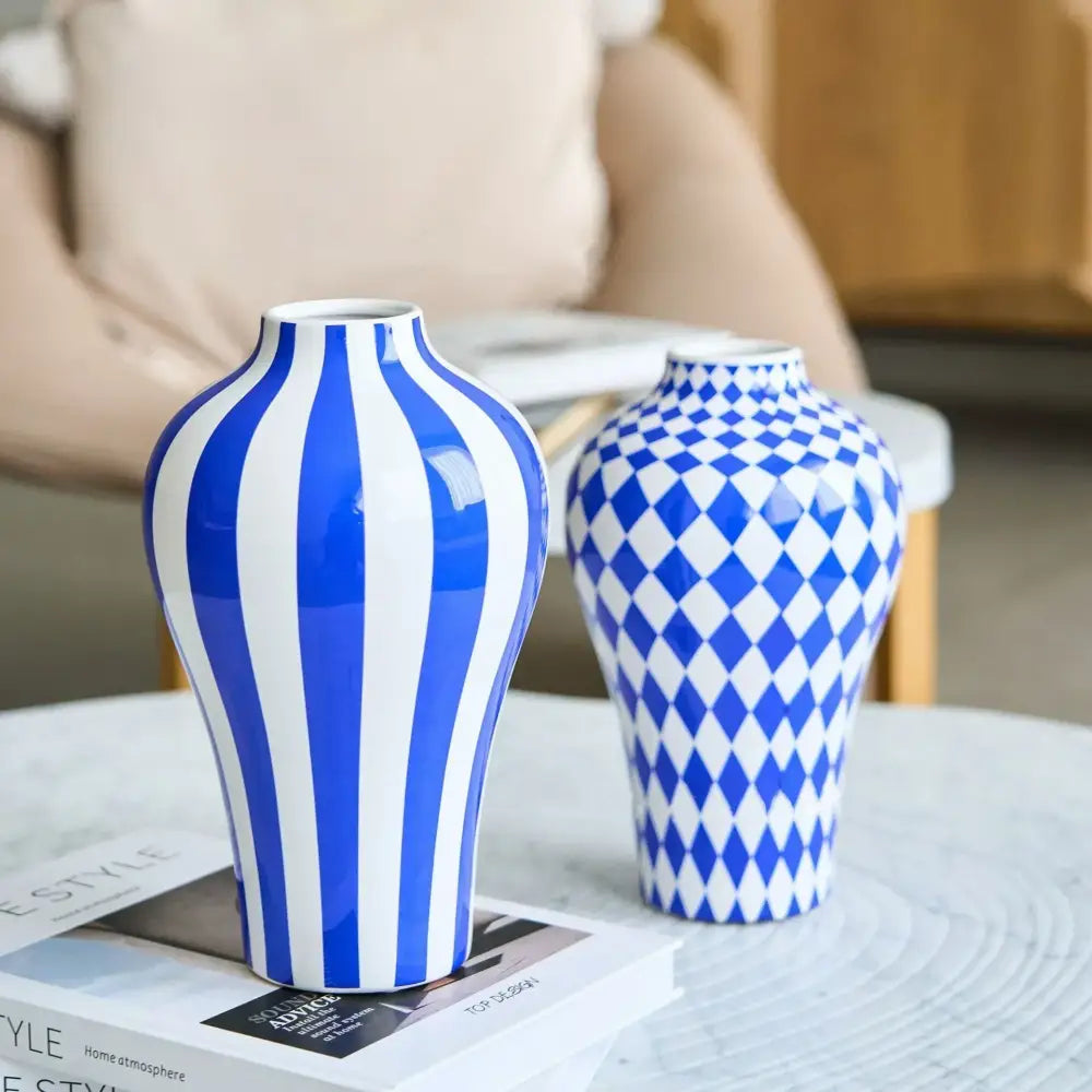 Two ceramic vases in blue geometric quilted and bold stripe patterns for decorbites blue geometric living room decor