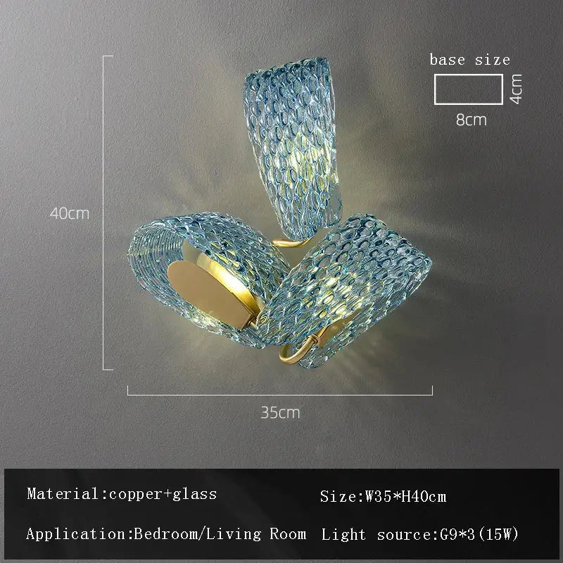 Blue textured glass wall sconce with copper accents complementing decorbites blue glass flower ceiling chandelier