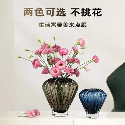 A sleek dark gray ribbed glass vase with transparent base inspired by hot air balloon decor for living room use