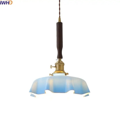 Blue glass led pendant lamp with brass fixture and dark wooden handle for dining room decorbites blue glass lighting