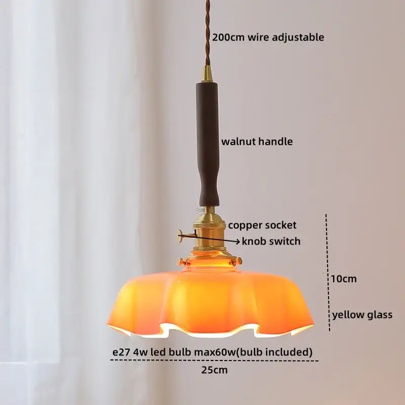 Warm yellow glass pendant lamp with walnut handle and copper socket complements decorbites blue glass led design