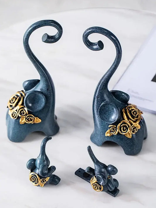 Set of four dark blue ceramic elephant family figurines with gold rose accents and curved trunks for family swing sculpture decor