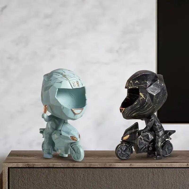 Two stylized motorcycle rider figurines in blue gold marble and black marble finish for decorative key storage decorbites display