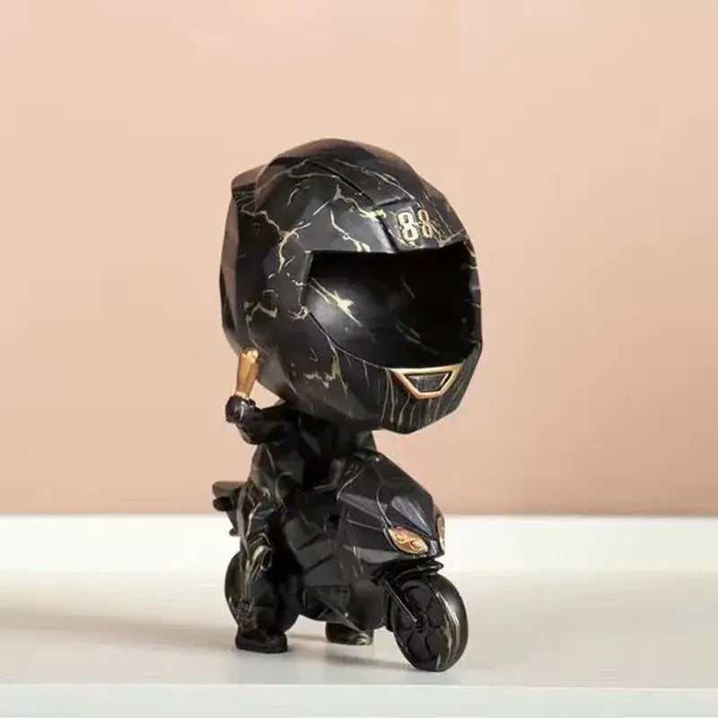 Black marble-patterned motorcycle helmet figurine with gold accents and chibi rider for decorative key storage decorbites