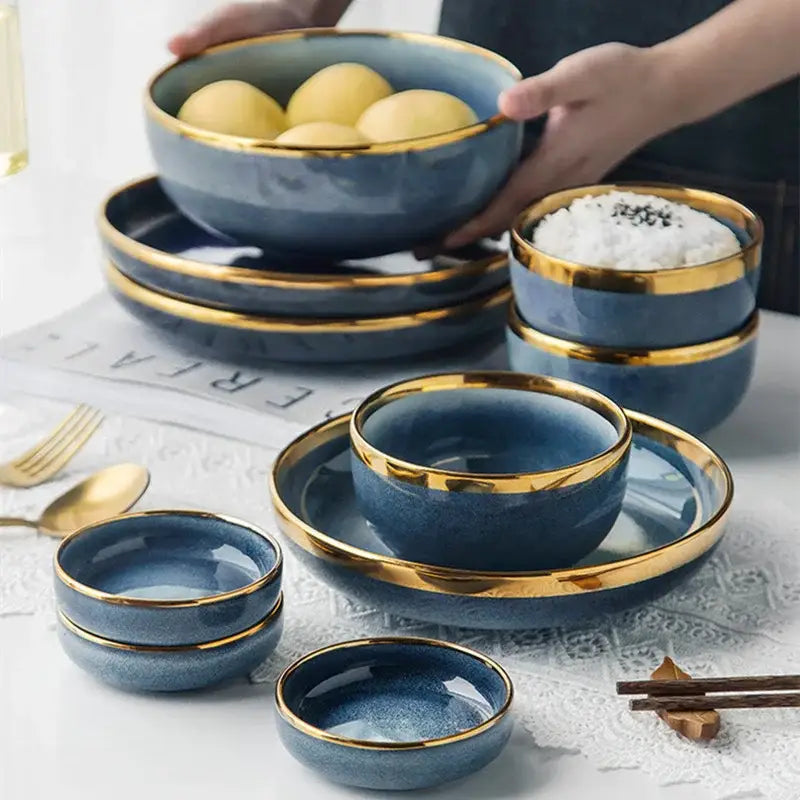 Blue gradient ceramic plate set featuring gold rims ideal for elegant dining room dinnerware use