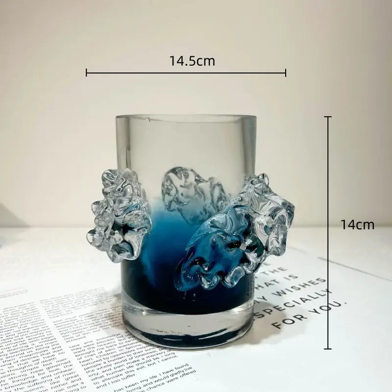A clear glass blue gradient wavy vase with sculpted translucent lion head handles for living room floral decor
