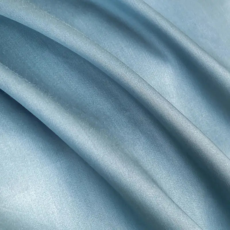 Light blue satin fabric with smooth glossy finish in decorbites cotton solid color bedding set for bedroom embroidery
