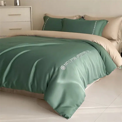 Blue and gray cotton solid bedding set featuring a sage green satin-like duvet cover with white embroidered decorbites logo