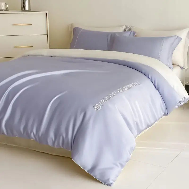 A soft lavender cotton solid color bedding set with subtle white embroidery by decorbites for bedroom use