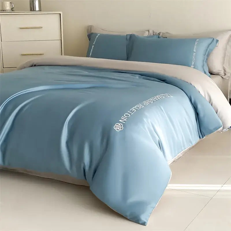 Light blue satin duvet cover with white embroidered text and logo in blue and gray cotton solid bedding set decorbites cotton solid color