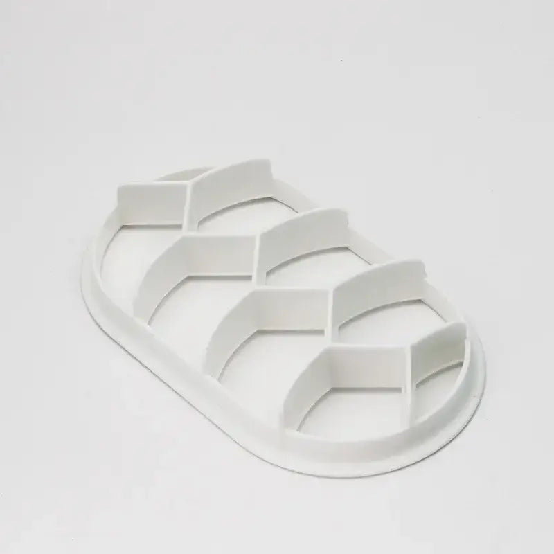 White plastic egg carton with six hexagonal compartments for blue honeycomb circular oval bread molds baking tool