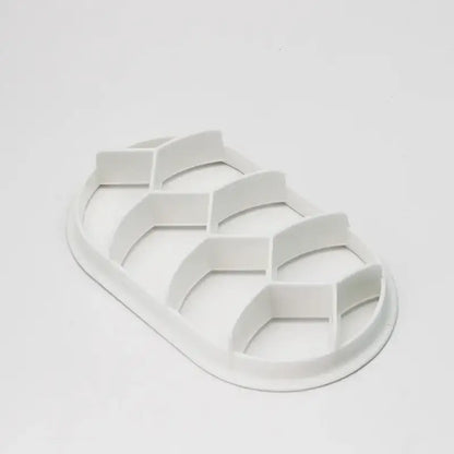 White plastic egg carton with six hexagonal compartments for blue honeycomb circular oval bread molds baking tool