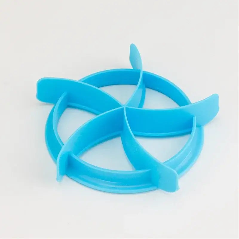 Bright blue silicone star-shaped egg ring with interlocking design for use as a baking tool and oval bread mold