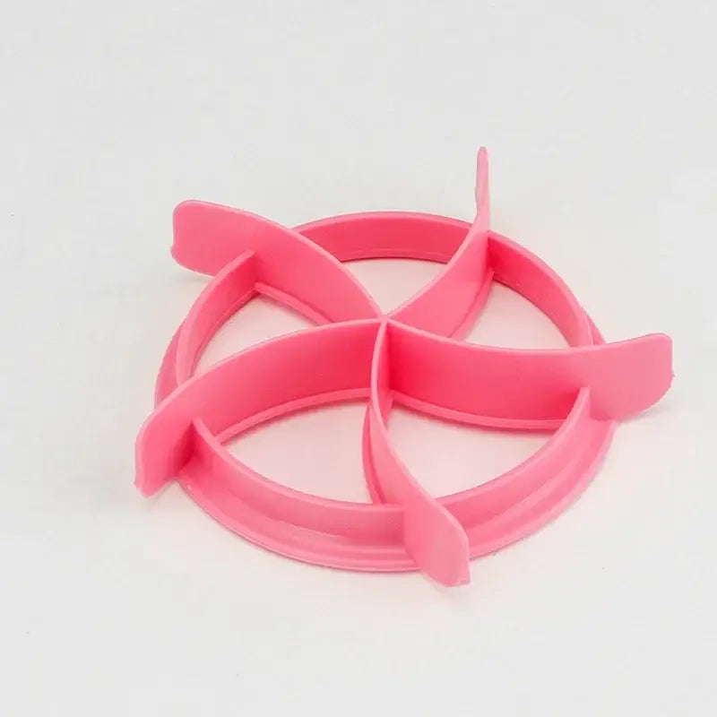 Pink plastic circular cookie cutter with four petal extensions for blue honeycomb and star oval bread molds baking tool