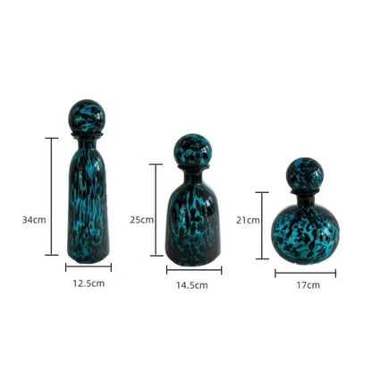 Set of three teal and black marbled glass decorative bottles with spherical stoppers for decorbites leopard print decor