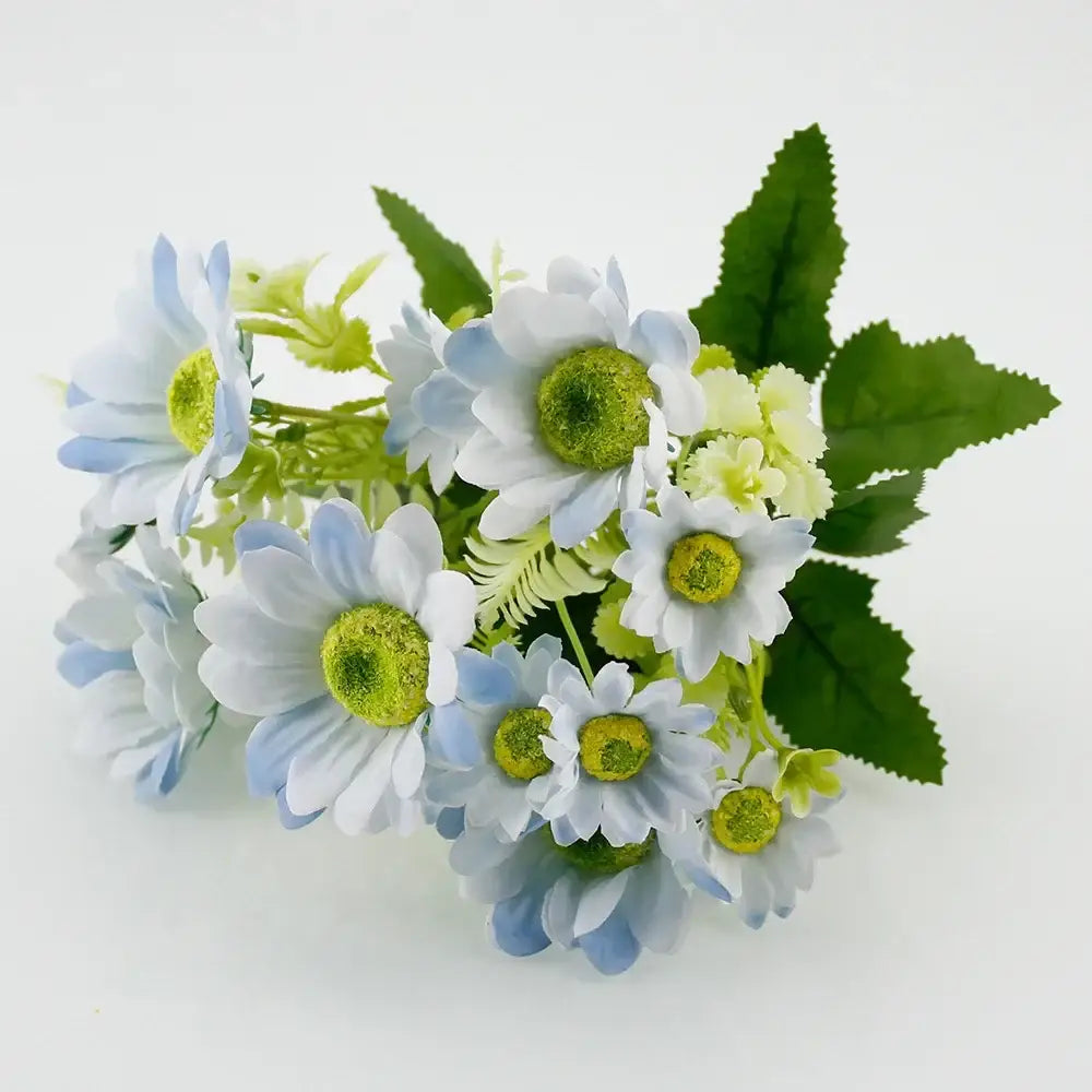 A delicate bouquet of silk fake flowers featuring blue peony, tea rose, and artificial daisies with vibrant green centers