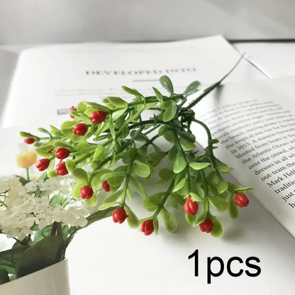 A vibrant artificial green sprig with glossy red berries complements blue peony and tea rose silk fake flowers