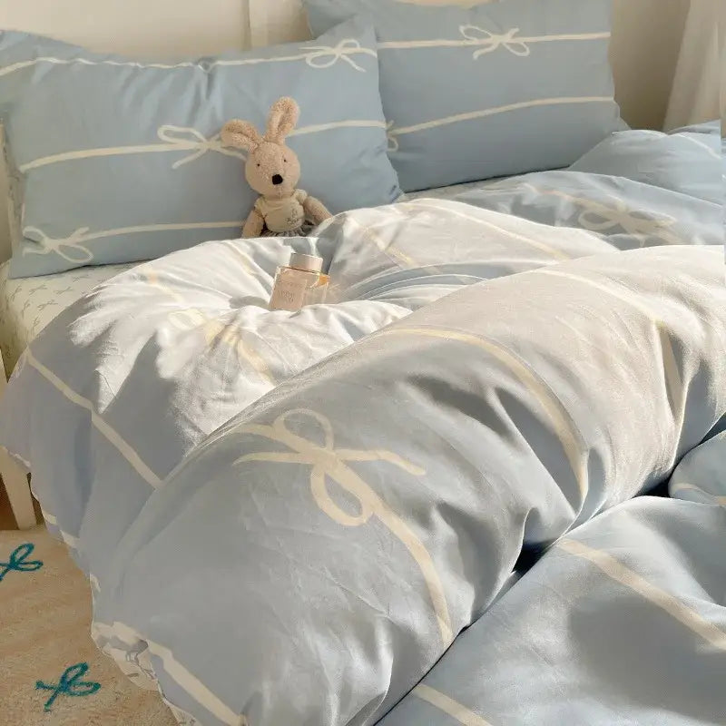 Light blue bedding set with cream ribbon bow patterns made of decorbites cotton cartoon printed fabric