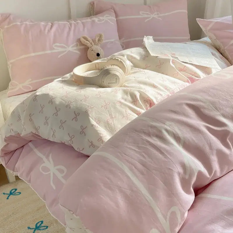 Soft pink and white bedding set with delicate bow patterns from decorbites cotton cartoon printed collection