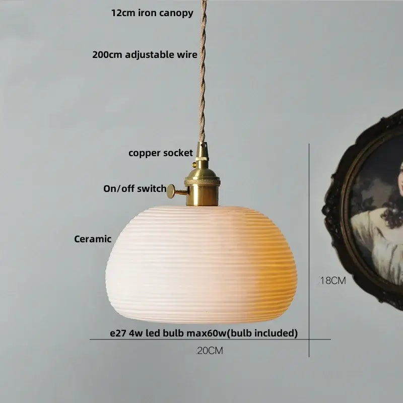 Warm-toned ceramic led pendant lamp with ribbed gradient finish from white to amber featuring brass accents by decorbites