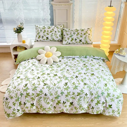 Blue starry sky duvet cover set with white and green leaf-patterned bedding and plush white daisy pillow on top