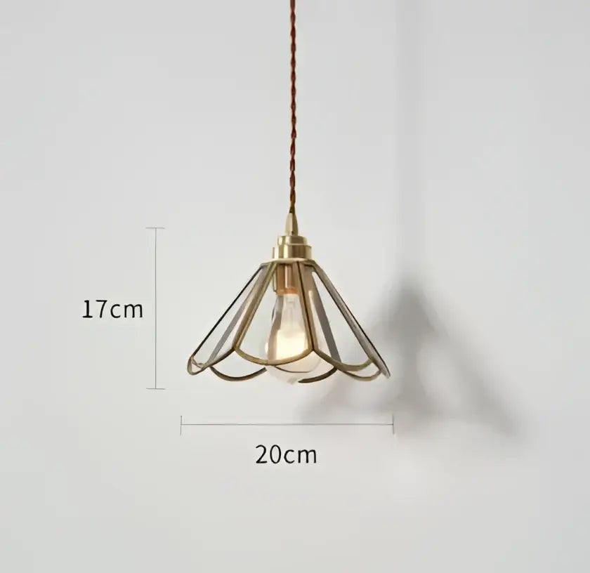 Blue translucent glass pendant lights with brass fixture featuring a brass-colored cage-style decorbites pendant light
