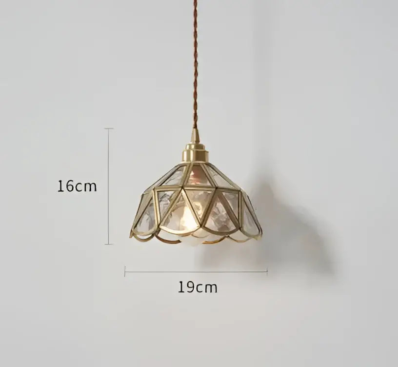 Blue translucent glass pendant lights with brass fixture featuring geometric faceted shade emitting warm glow decorbites pendant lights