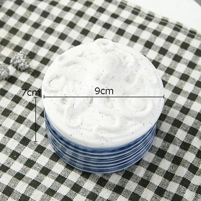 White ceramic coaster with blue rim and intricate embossed design for decorbites ceramic marine life bedroom decor