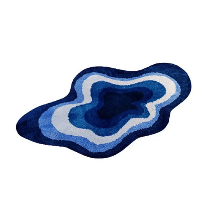 Blue agate-shaped decorbites cloud shaped tufted rug with concentric navy, medium blue, and white rings for bathroom use