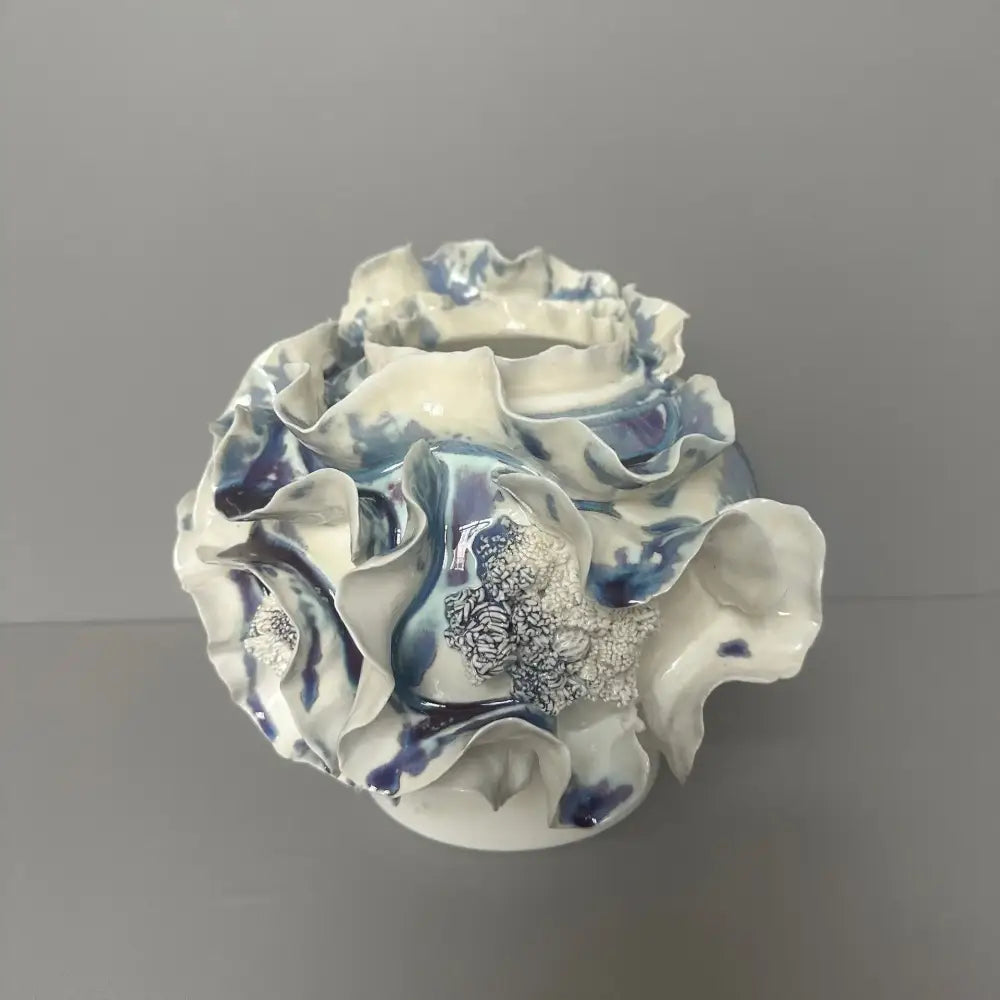 A handmade porcelain fold pattern vase with white and blue glaze for living room decor by decorbites