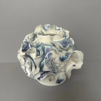 A handmade porcelain fold pattern vase with white and blue glaze for living room decor by decorbites
