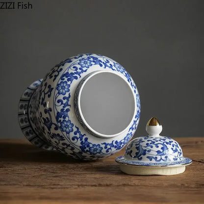 Blue and white porcelain jar with intricate floral patterns, gold plating, and matching lid for living room decor