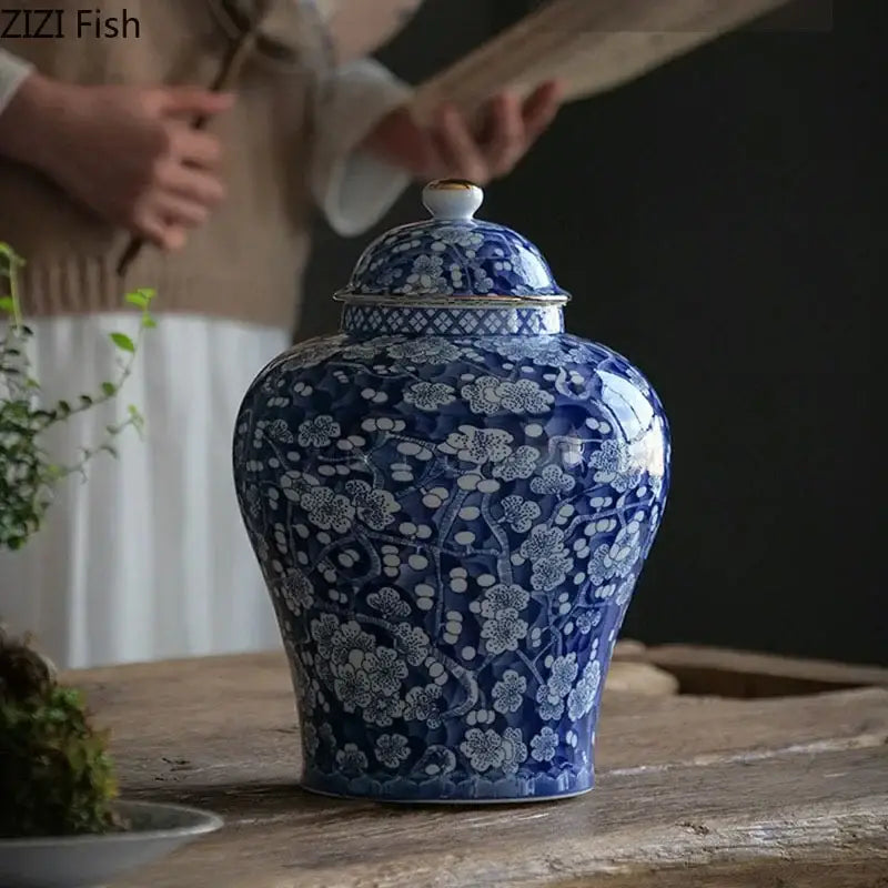 Blue and white white porcelain jar with gold plating and intricate floral patterns for living room decor