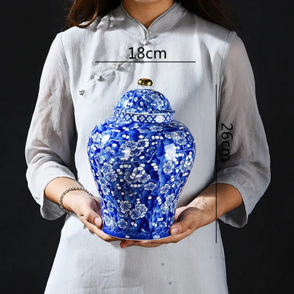 Blue and white porcelain pot sealed storage tank with intricate floral patterns and gold-colored lid for kitchen use